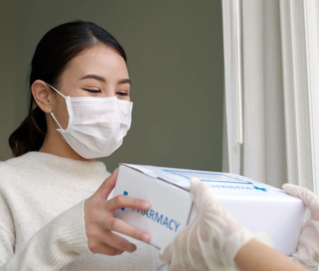 Woman receiving free medication delivery